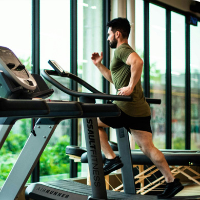 Man running on treadmill.